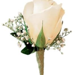 Single cream rose boutonniere with small white filler flowers