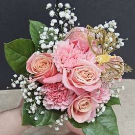 Pink rose and carnation bouquet with white baby's breath and a gold butterfly pick