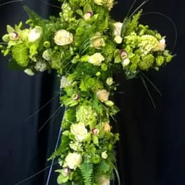 Green floral cross with white roses and hydrangeas