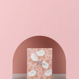 Pink scented sachet package standing against a pink backdrop