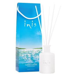 Blue fragrance diffuser box with a white reed diffuser bottle