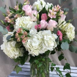 Pink and white bouquet in a glass vase