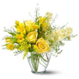 Yellow roses and alstroemeria in a clear glass vase