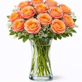 Bouquet of peach roses in a clear glass vase