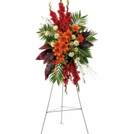 Tall red and orange floral spray on a metal easel