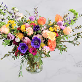 Colorful mixed bouquet in a clear glass vase