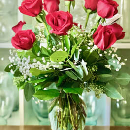 Bouquet of red roses in a glass vase