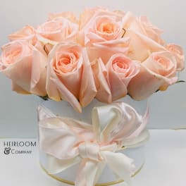 Bouquet of pale peach roses in a white hat box with a satin ribbon