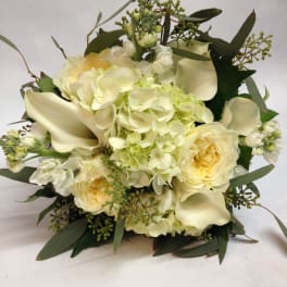 Cream bouquet with hydrangeas, roses, and calla lilies