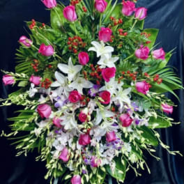 Large standing floral spray with pink roses and white lilies