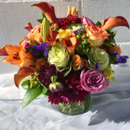Colorful mixed bouquet in a clear glass vase