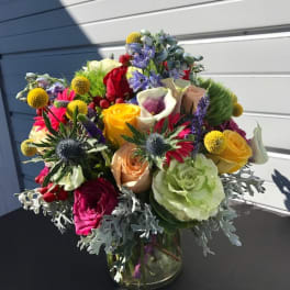 Colorful mixed bouquet in a clear glass vase