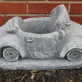 Gray concrete planter shaped like a small car