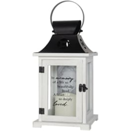 White memorial lantern with a candle inside