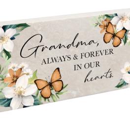 Decorative sympathy plaque with flowers and butterflies and the words Grandma, always & forever in our hearts.
