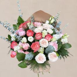 Bouquet of pink and white roses with blue eucalyptus accents