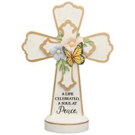 Decorative memorial cross with flowers and a butterfly