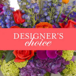 Colorful mixed flower arrangement with a designer's choice banner