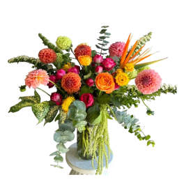 Colorful mixed flower arrangement in a glass vase