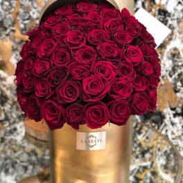 Bouquet of deep red roses in a gold cylindrical box