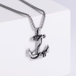 Silver anchor pendant necklace on a white box