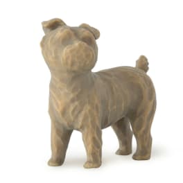 Small brown dog figurine standing on a white background
