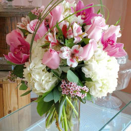 Pink and white mixed bouquet in a clear glass vase
