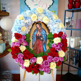 Large floral wreath around an image of the Virgin of Guadalupe
