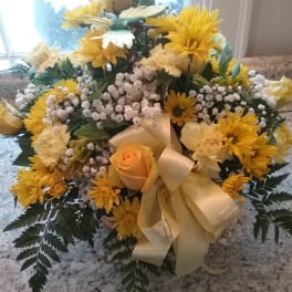 Yellow and cream floral bouquet with a satin ribbon bow