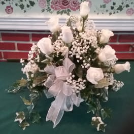 White rose bouquet with baby's breath and a sheer ribbon