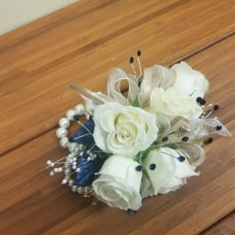 Small bouquet of white roses with pearl and ribbon accents