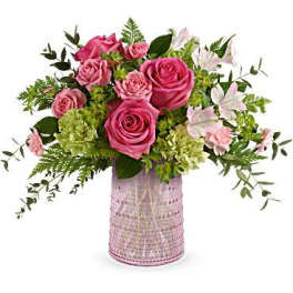 Pink roses and white lilies in a pink textured vase