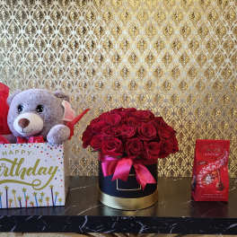 Birthday gift box with teddy bear, roses, and chocolates