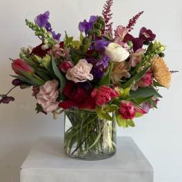 Colorful mixed bouquet in a clear glass vase