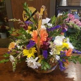 Mixed flower basket with daisies, gerbera daisies, and roses