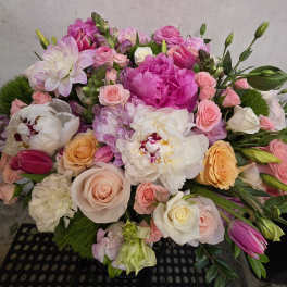 Mixed bouquet of pink, white, and peach flowers