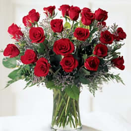 Bouquet of red roses in a clear glass vase