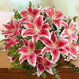 Bouquet of pink stargazer lilies with greenery