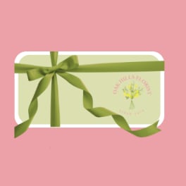 Gift card with a green ribbon bow on a pink background
