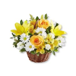 Yellow roses and white daisies in a wicker basket
