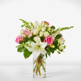 Pink and white mixed bouquet in a clear glass vase