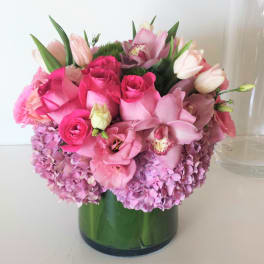 Pink and lavender bouquet in a glass vase