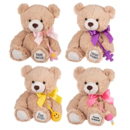 Four plush teddy bears with ribbons and small hanging charms.