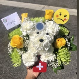 White floral teddy bear bouquet with yellow roses and emoji accents