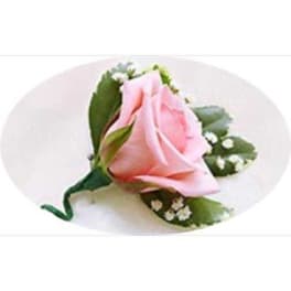Single pink rose boutonniere with small white filler flowers