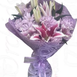 Lavender bouquet with lilies and chrysanthemums wrapped in purple paper
