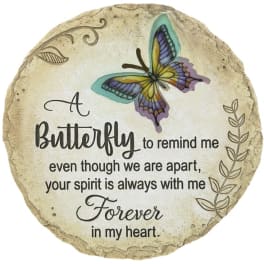 Round memorial plaque with a butterfly and remembrance message