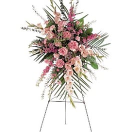 Pink floral standing spray on an easel