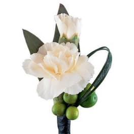 White carnation boutonniere with green berries and dark leaves