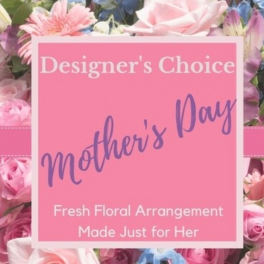 Pink floral arrangement with a Mother's Day sign
